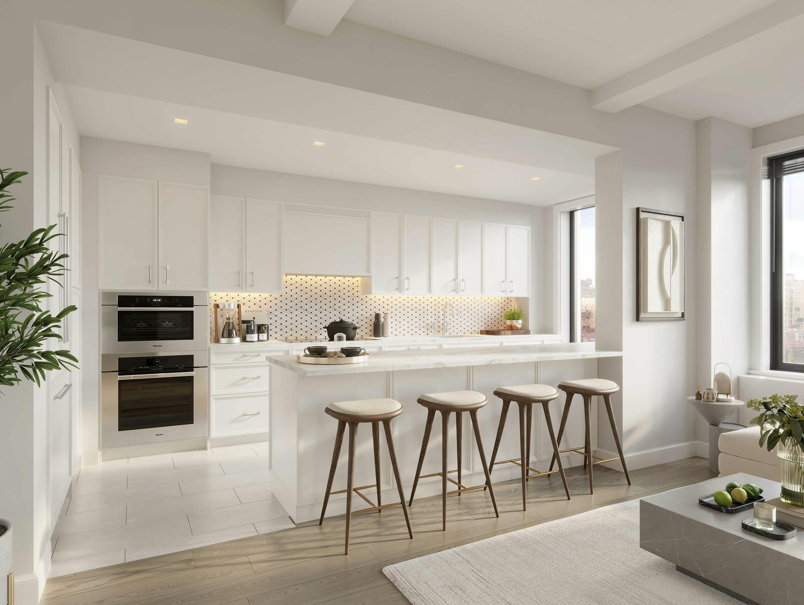 white modern kitchen with barstools at The Laney